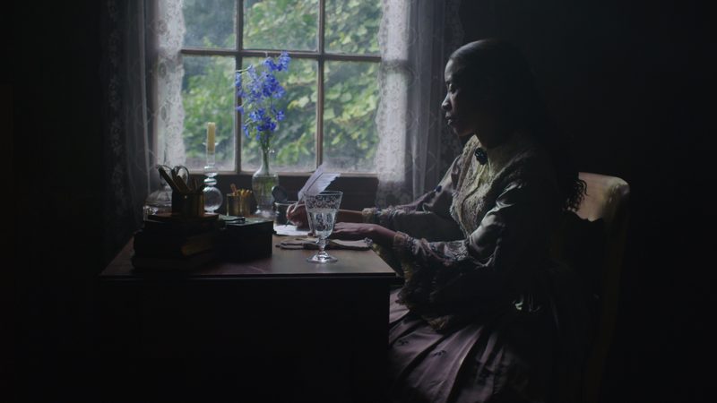 Woman writing at a table